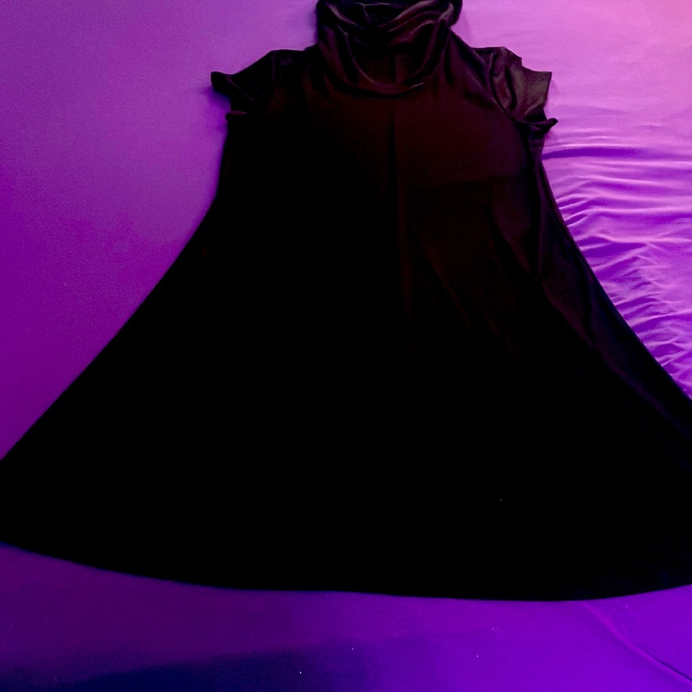 Black stretchy/spandex dress. I believe it has some sort of face mask/turtle nec